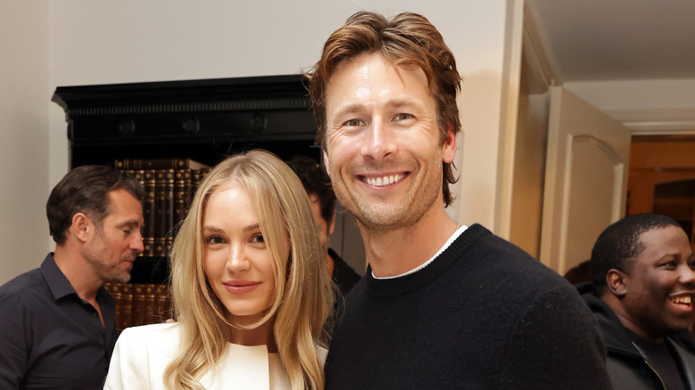 Michelle Randolph and Glen Powell pose together for a photo