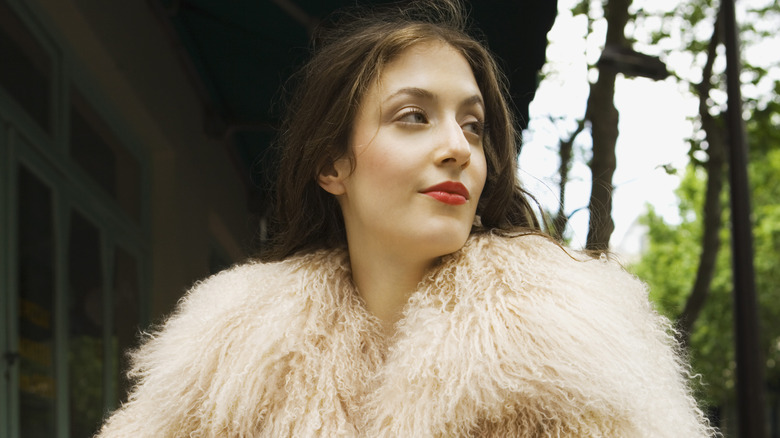 Woman wearing shearling coat