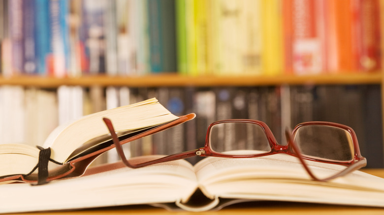Colorful books with glasses