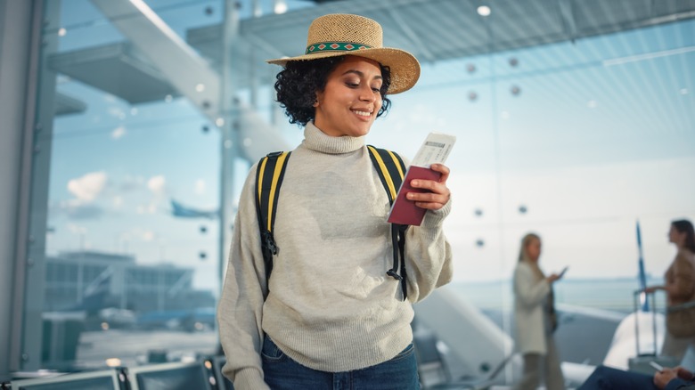 woman with plane ticket
