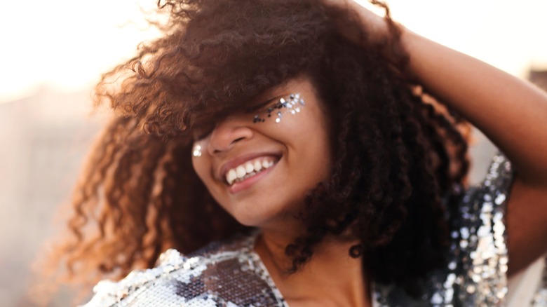 woman with natural hair laughing