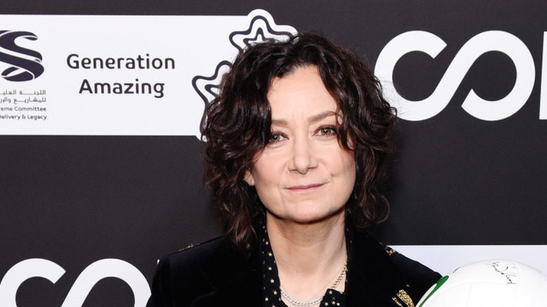 Sara Gilbert wearing a black jacket