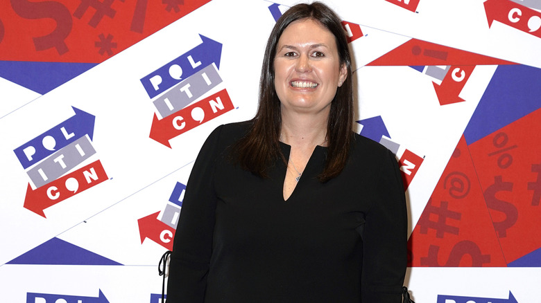Sarah Huckabee Sanders in a black shift dress at Polticon 2019