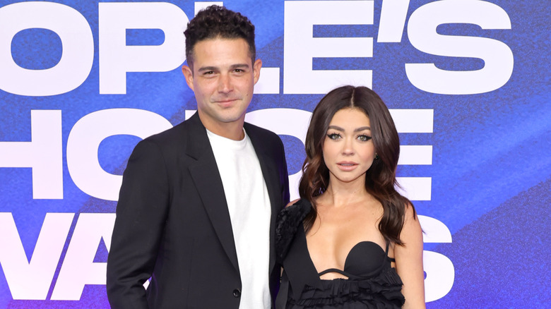Sarah Hyland and Wells Adams dressed in black at the Peoples Choice Awards