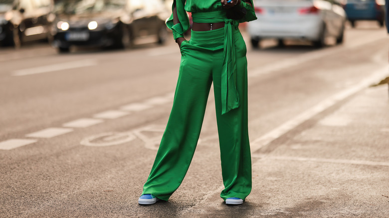 woman wearing satin top and pants