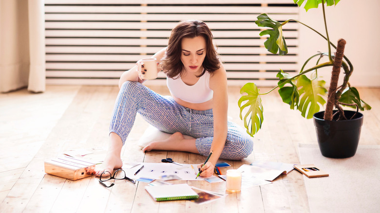 Woman making scrapbook