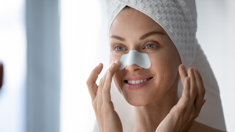 woman with blackhead strip