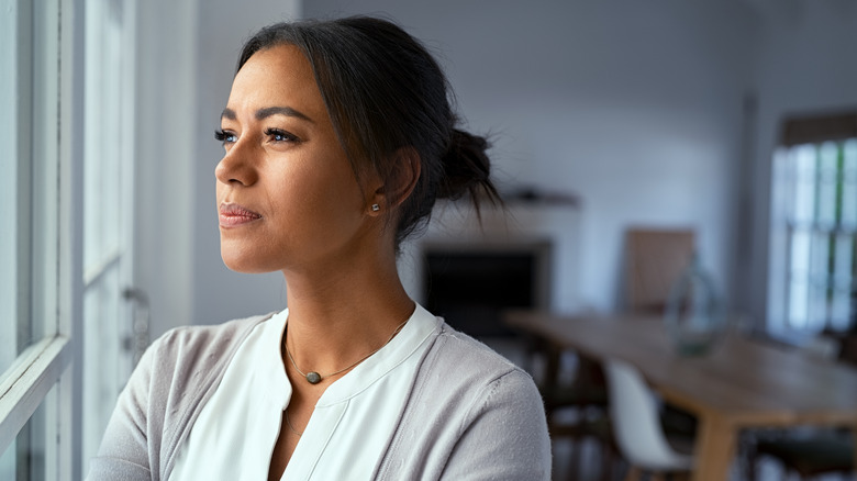 Woman looking outside