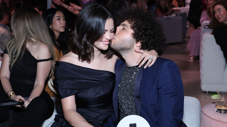 Benny Blanco kissing Selena Gomez's cheek in 2024