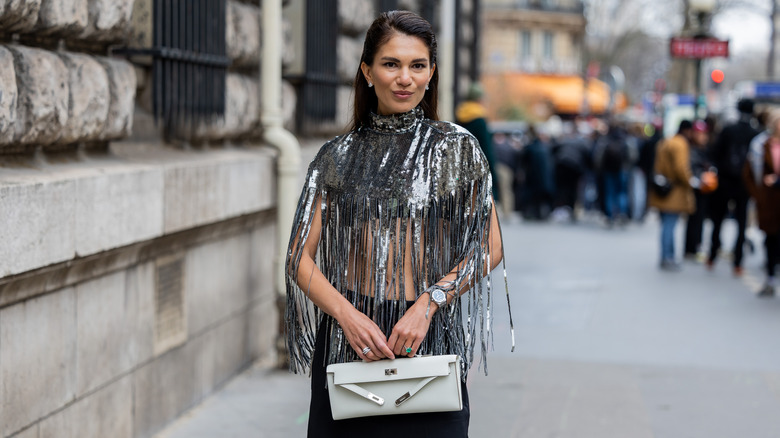 woman with silver sequined crop top 