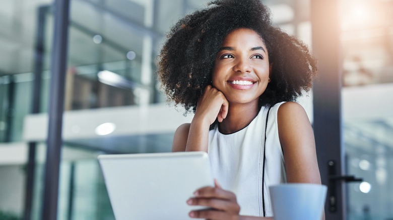 Woman smiling at work desk