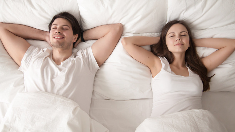 couple relaxing in bed