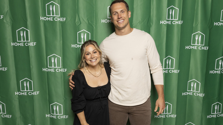 Shawn Johnson and Andrew East at the step and repeat during the 