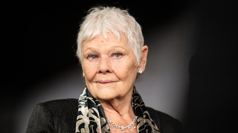Judi Dench posing with short hair