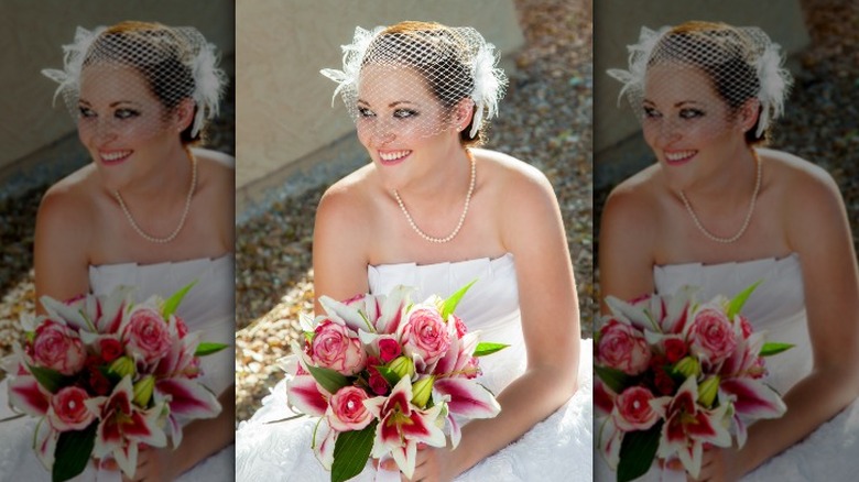 Bride wearing birdcage veil