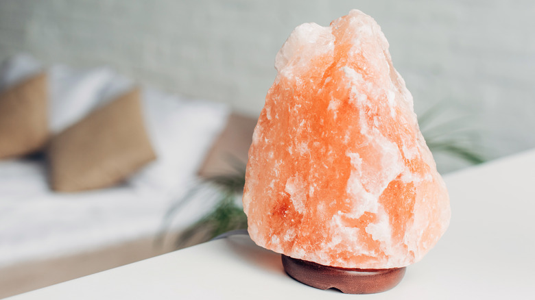 Salt lamp on bedroom shelf