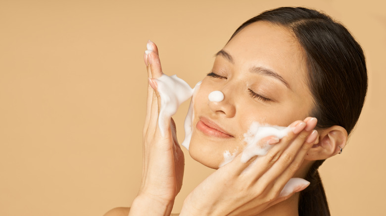 Woman washing face  