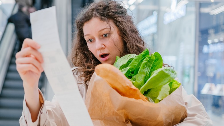 shopper looking at her bill