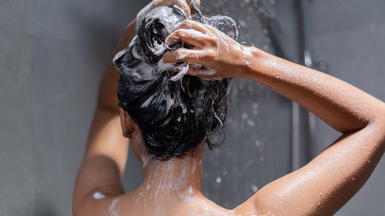 woman washes hair