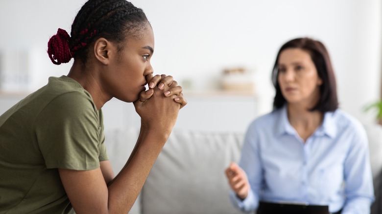 pensive woman with therapist