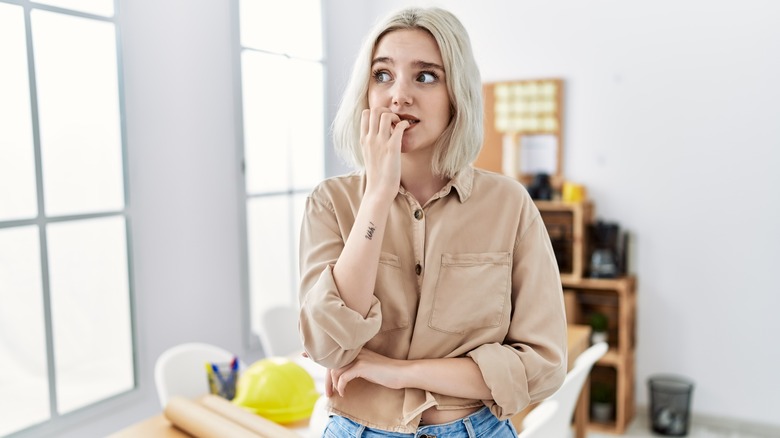 woman biting her nails