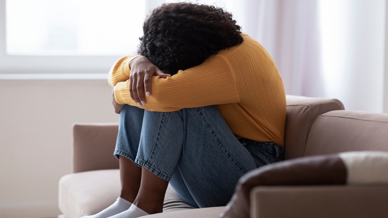 woman sitting on couch