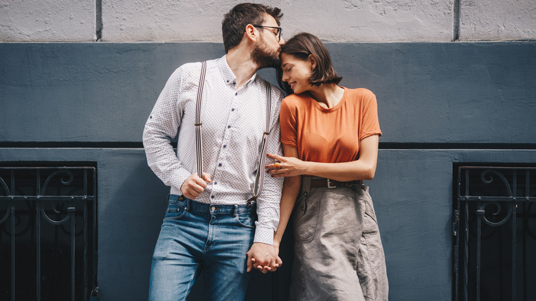 Couple holding hands