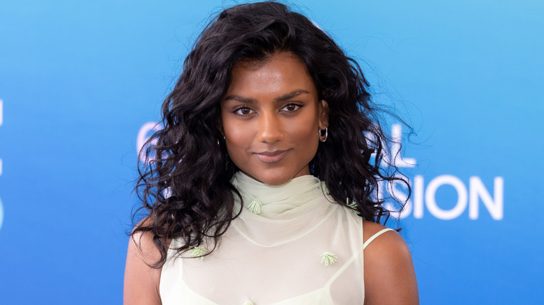 Simone Ashley curly hair sheer dress