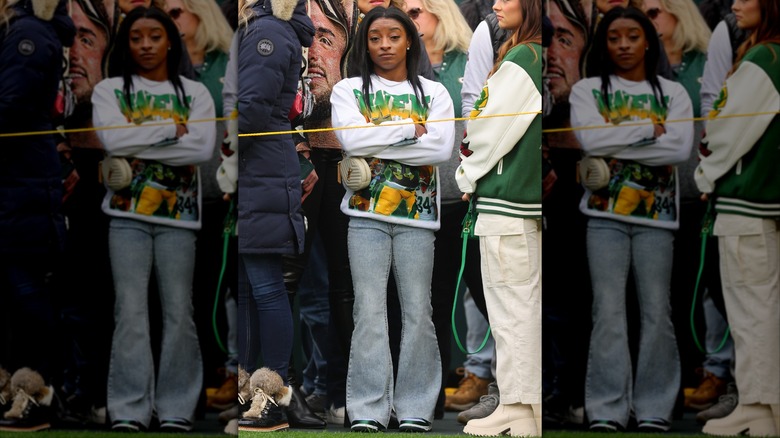 Simone Biles wearing flared jeans at a Green Bay Packers football game