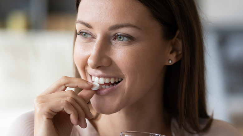 female taking pill