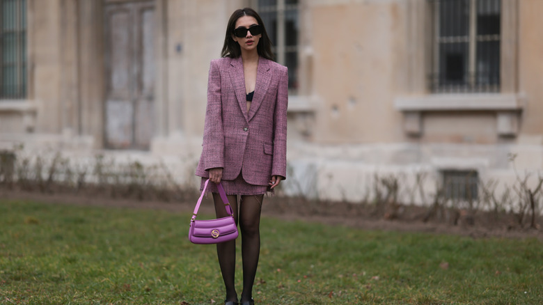 woman wearing purple skirt suit