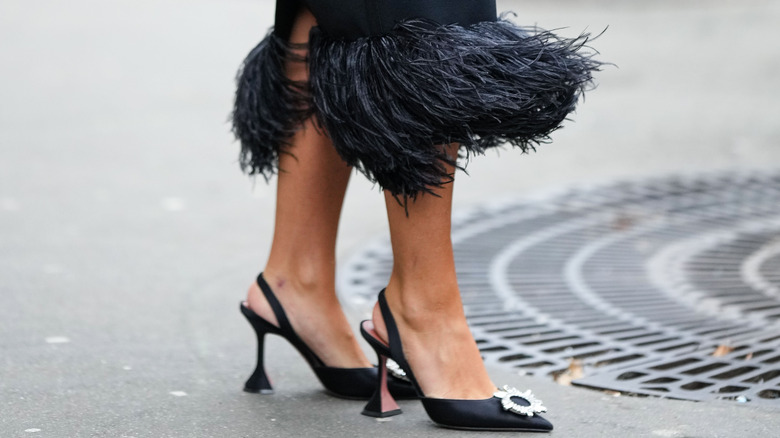 woman in black slingback heels