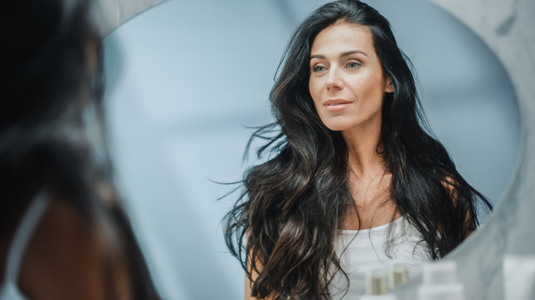 Woman with long ashy brown hair