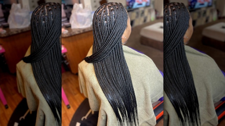 Woman with ashy brown box braids