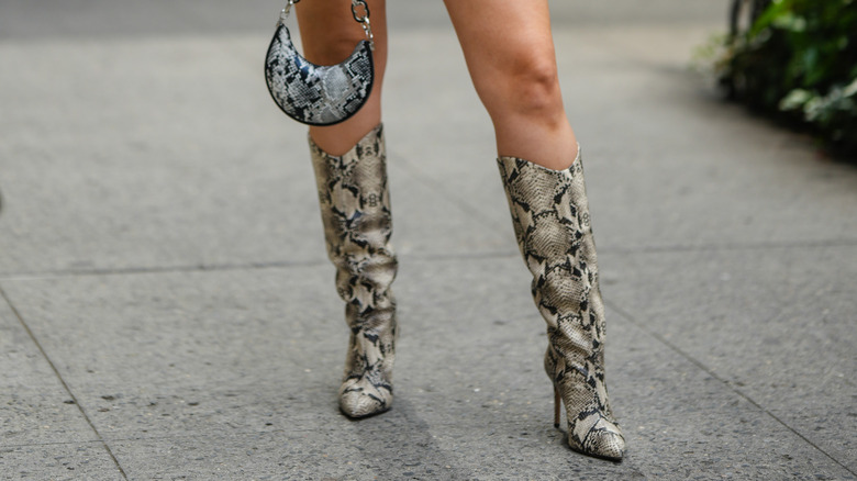 Girl wearing snakeskin accessories