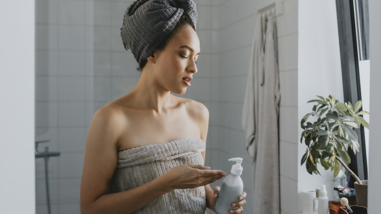 A woman getting out of the shower