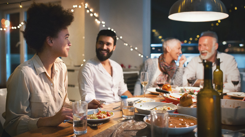 Woman at dinner with in-laws