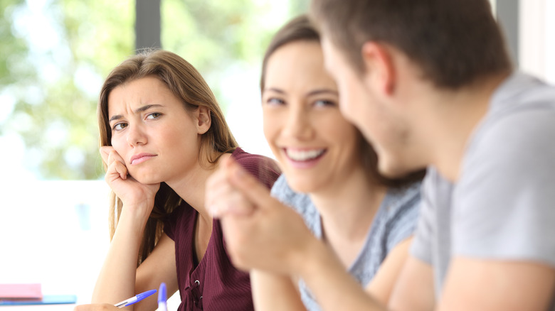 annoyed woman looking at man