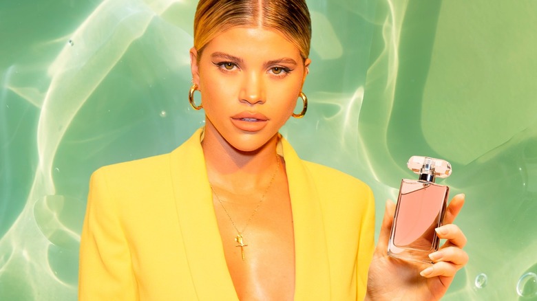 Sofia Richie Grainge holding perfume bottle