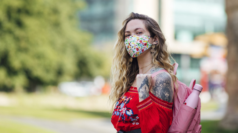 Woman with sombré hair wearing a mask