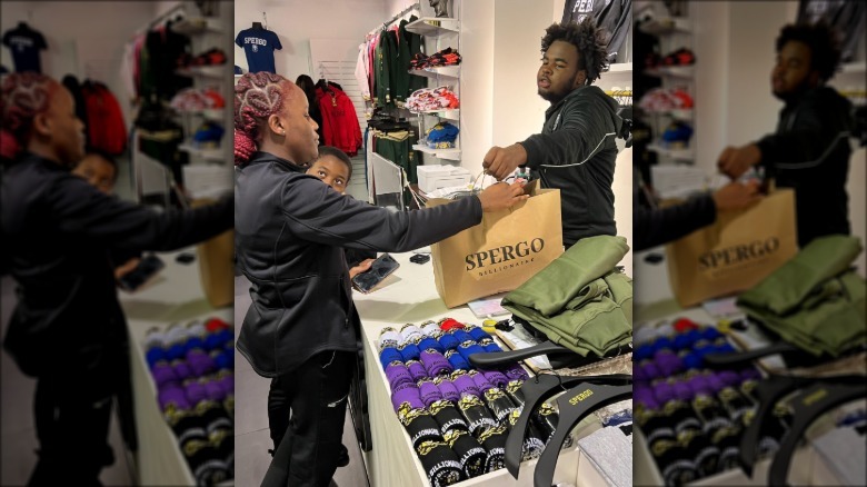 Handing a customer a SPERGO bag