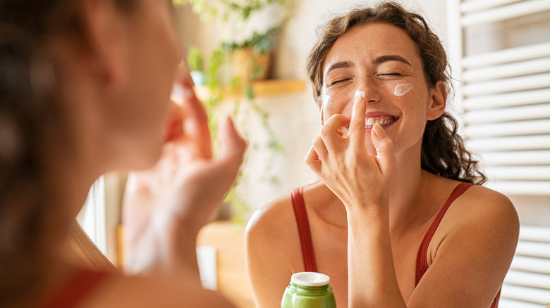 Woman applying cream