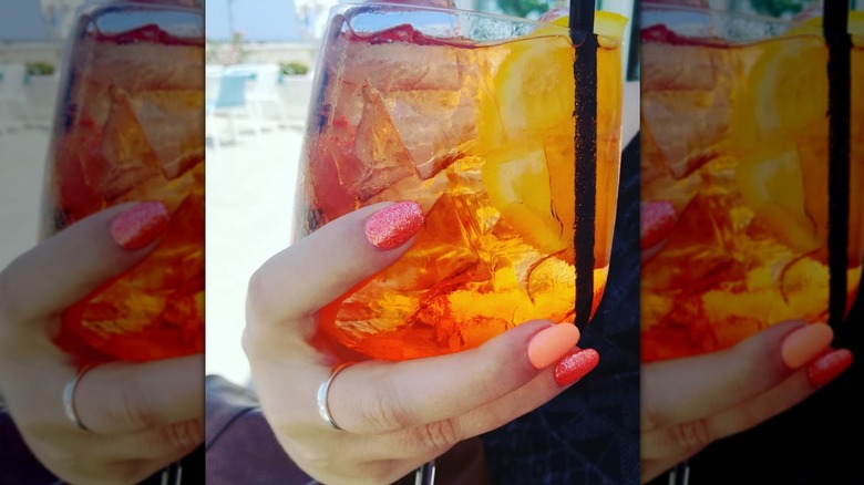 woman holding drink
