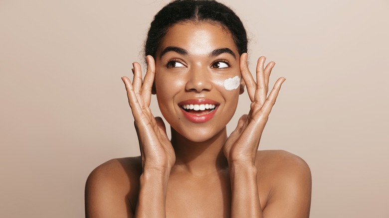 woman with skincare on face