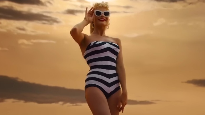 Margot Robbie as Barbie in chevron swimsuit