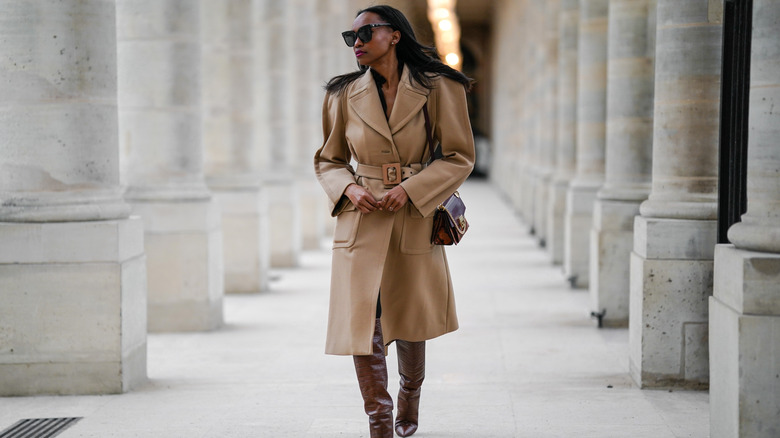 woman in trench coat and boots