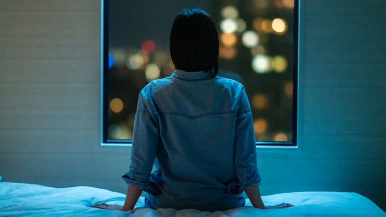 Woman looking out of window