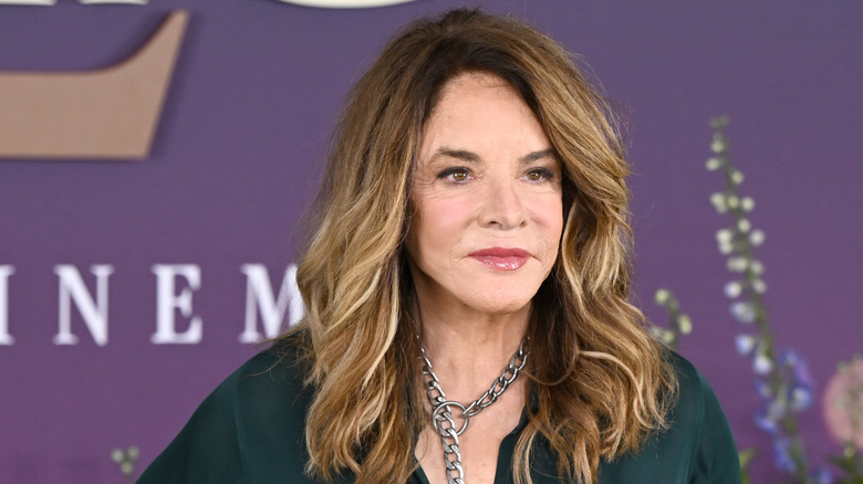 Stockard Channing posing in a green top with long highlighted hair.