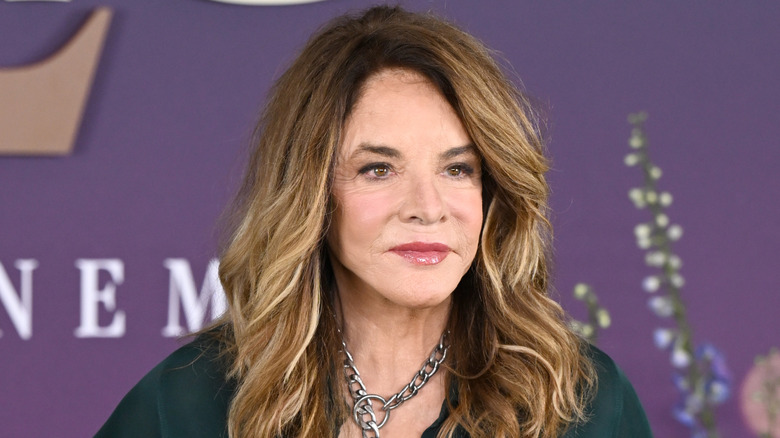 Stockard Channing posing in a green top with long highlighted hair.