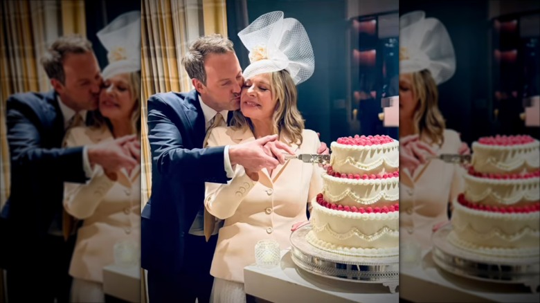 Russell Thomas kisses Kim Cattrall who wears a white netted fascinator and a white jacket